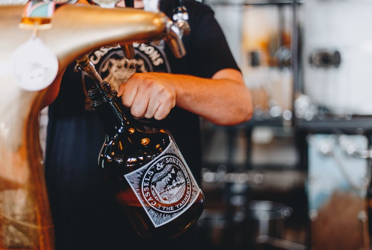 A bottle being filled up with craft beer at The Brewery Christchurch.