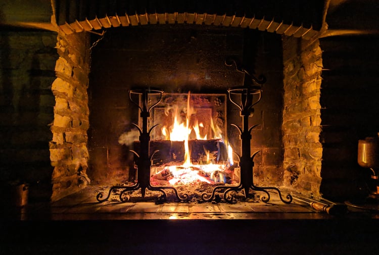 Roaring fire in fireplace by Stephane Juban.