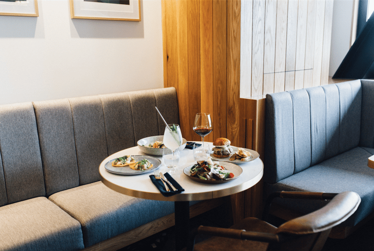 Sharing plates on a table at Earl, Christchurch