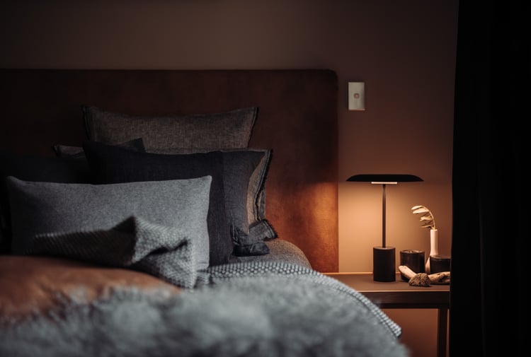 A bed inside Maruia River Retreat.