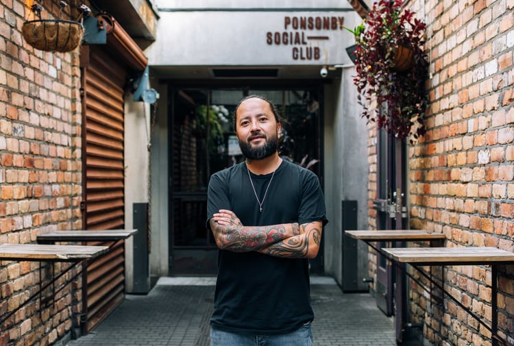 Bobby Brazuka standing in front of his business the Ponsonby Social Club in Auckland.