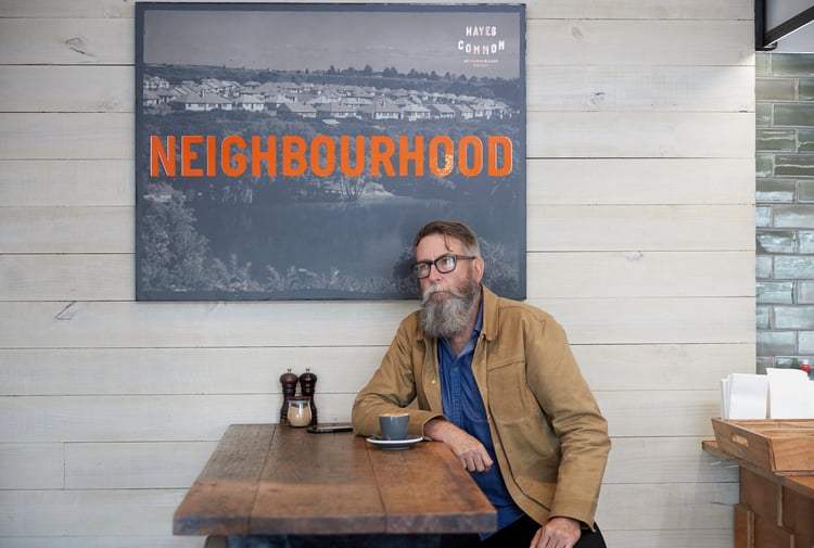 Alan Deare sitting in a cafe.