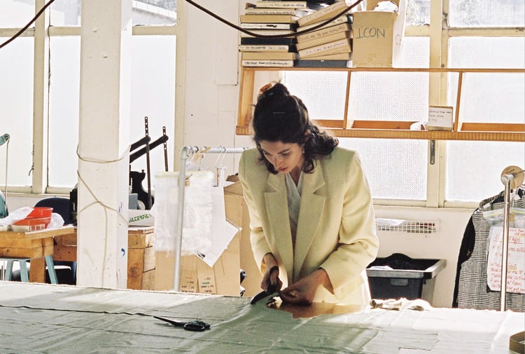 Rachel Mills at work cutting a pattern.