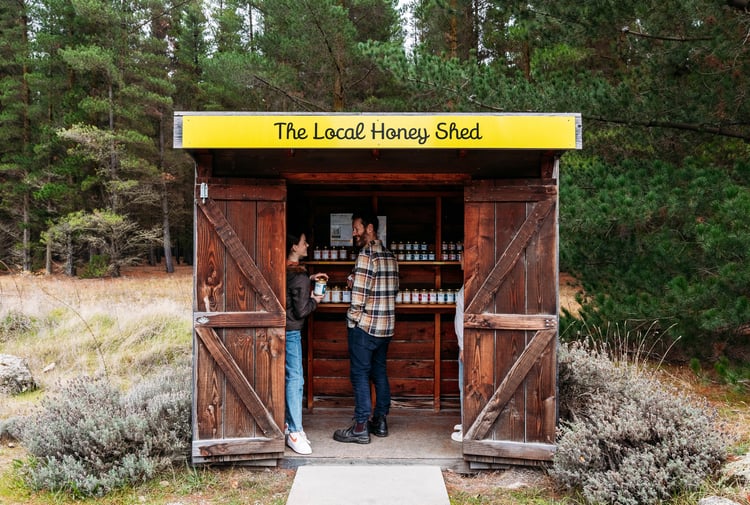 Two customers inside the roadside stall of Forage and Gold.