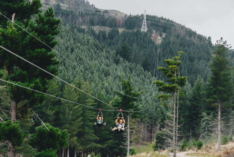 Someone zip-lining at Christchurch Adventure Park in the Port Hills, Christchurch.