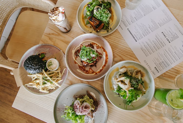 A flatlay of plates of food on a table at Mint Folk in Twizel.