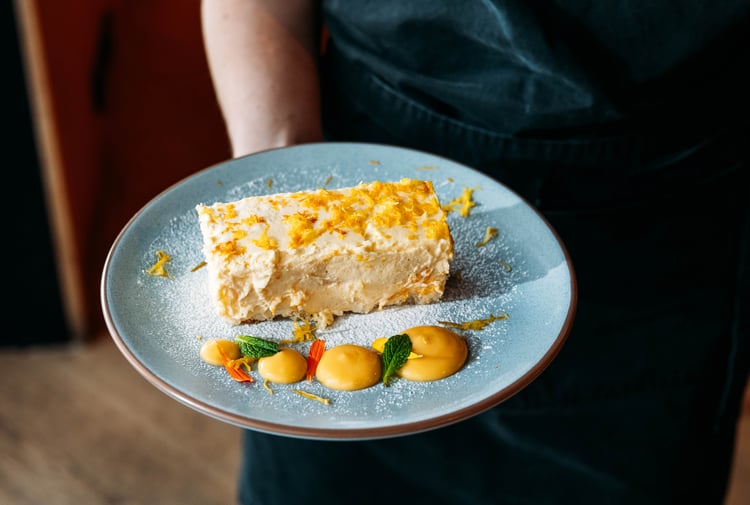 A cheesecake on a plate.