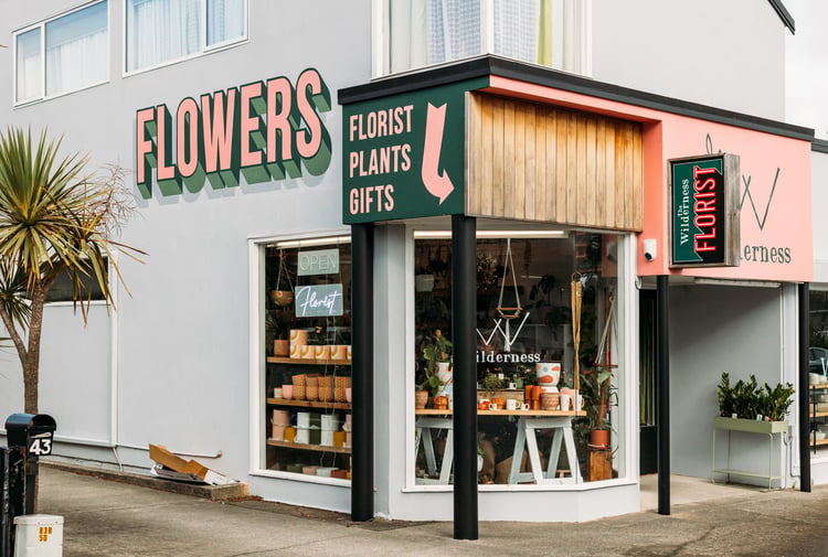 The green, pink and grey exterior of The Wilderness florist store in Paraparaumu.