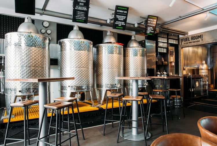 Steel drums making beer in a brewery.