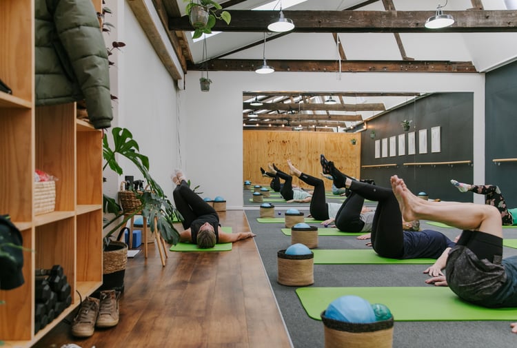 A pilates class in action at Well Studio.