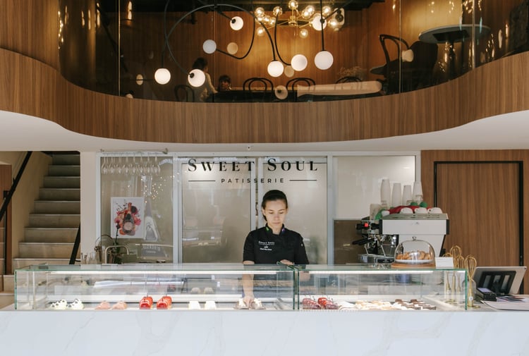 Rea Scur working behind the counter at Sweet Soul Patisserie in Christchurch.