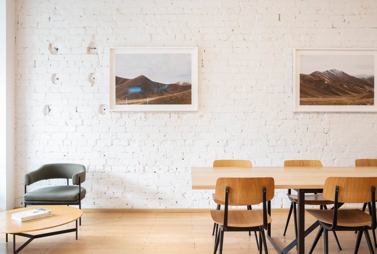 Tables and chair inside Daily Bread Auckland on a sunny day.