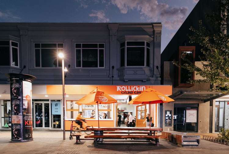 An orange cafe at night time.