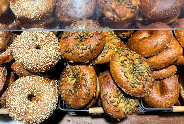 Cabinet full of bagels on display at Downtown Bagels.