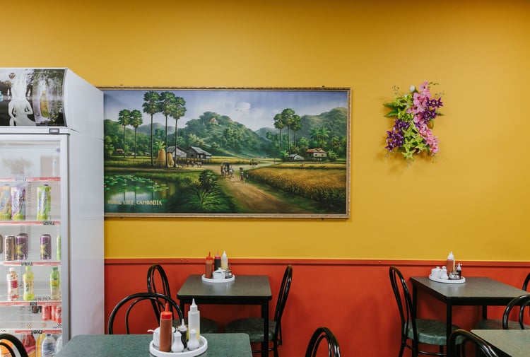 Inside Chinese Restaurant with dining table and yellow and red painted wall