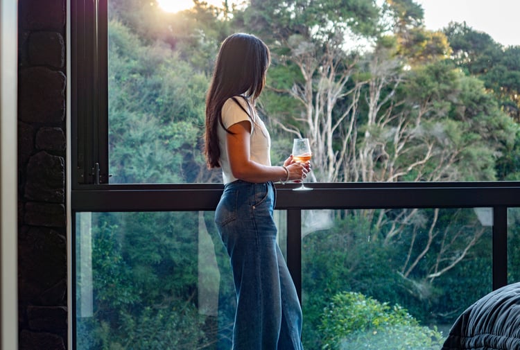 Guest looking at the view from the balcony.