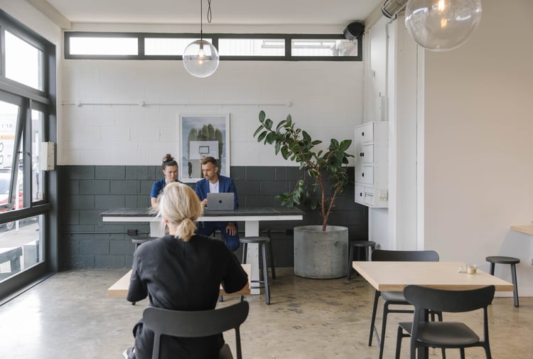 People working in a cafe.