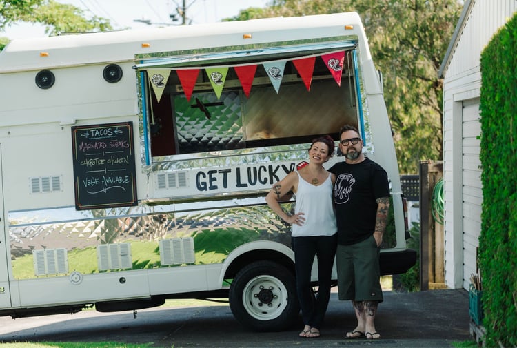 Sarah and Otis Frizzell standing in front of their fodo truck.