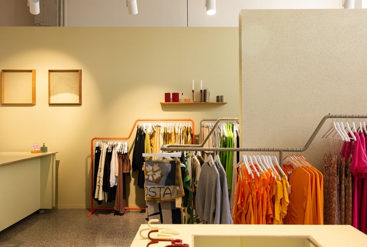 Colourful items and a rack of clothing from FOUND store in Hamilton.
