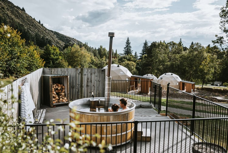 Two people in a hot tub at Cross Hill in Lake Hawea.
