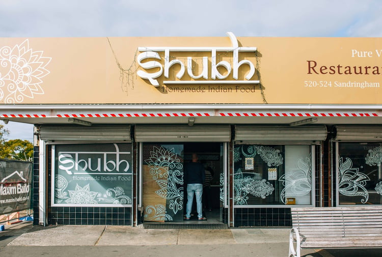 The entrance to a restaurant on a sunny day.