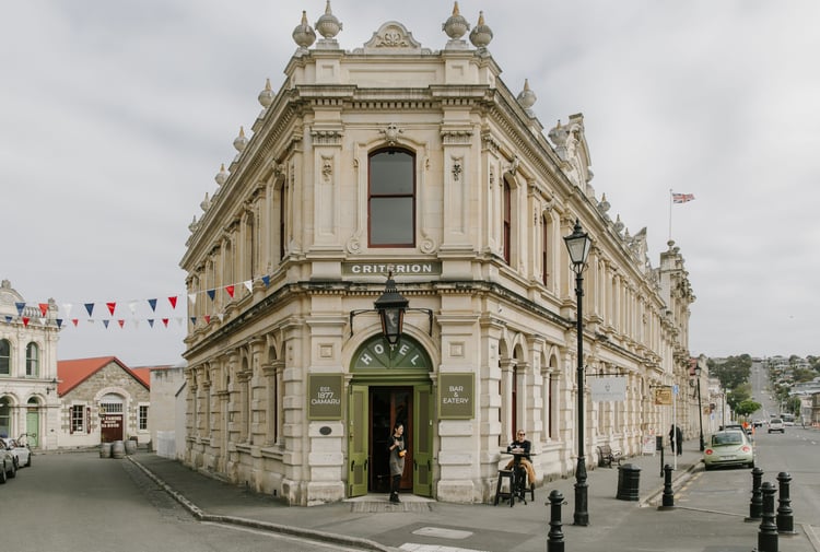 An old Oamaru stone building on a cloudy day.