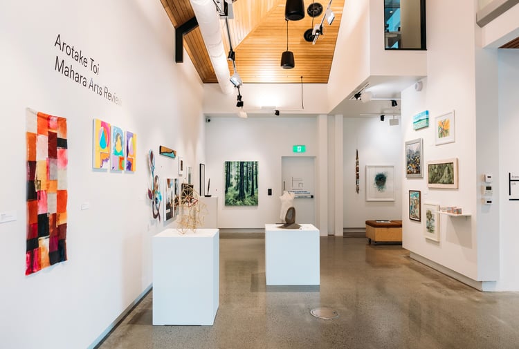 Interior view of a white-walled art gallery.