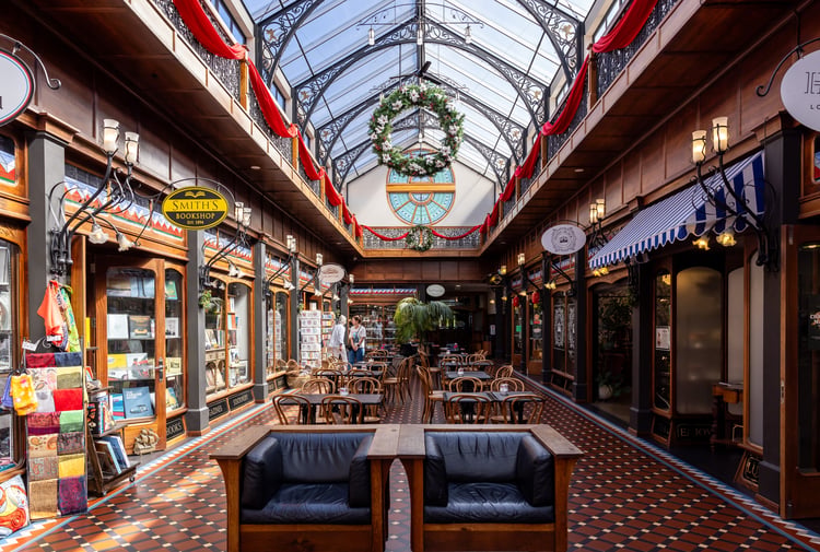 Entrances to various shops in the atrium of The Tannery.