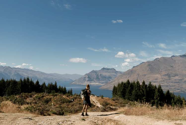 A female walker on top of Queenstown Hill.
