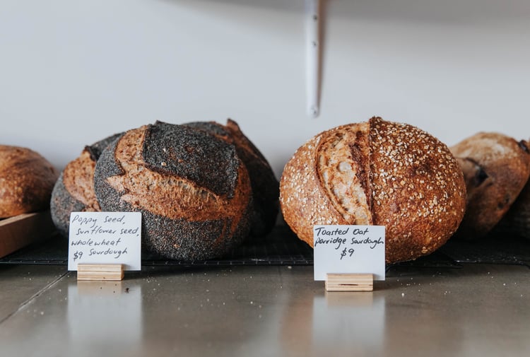 Round loaves of sourdough on a counter.