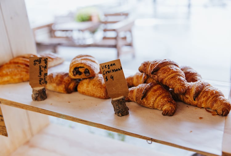 Vegan croissants on display inside a cafe.