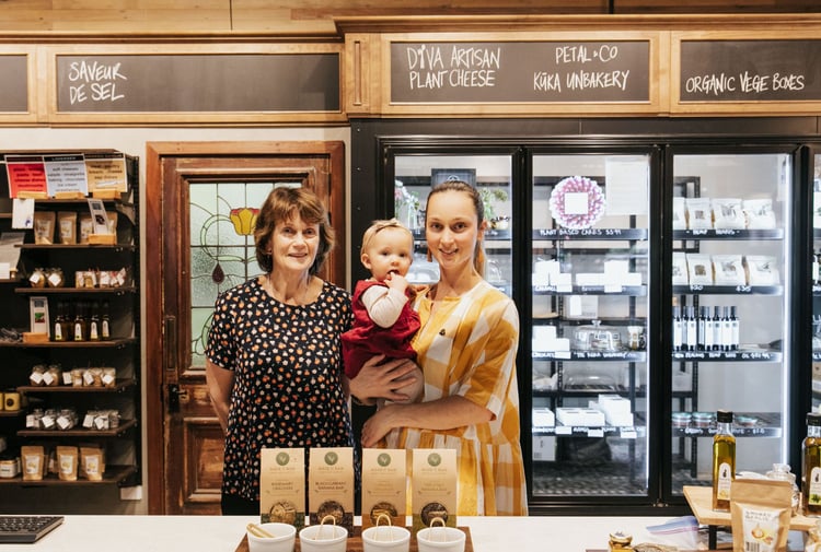A photo of Julia with her mother and child.