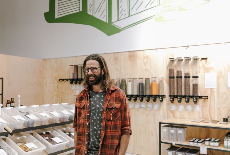 Close up of Jesse Herbert standing inside Freshlink Grocer.