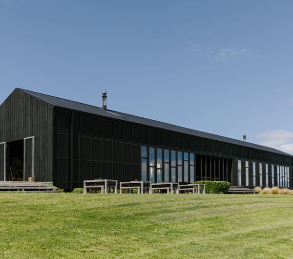 The exterior of the Black Estate building on a sunny day.