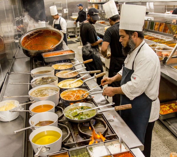 Chefs working inside the kitchen at Paradise in Auckland.