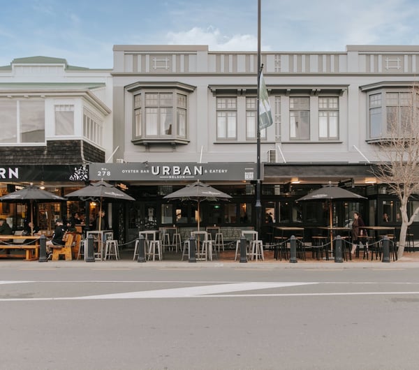 A photo of the front entrance to two iconic Nelson bars, taken from across the street.