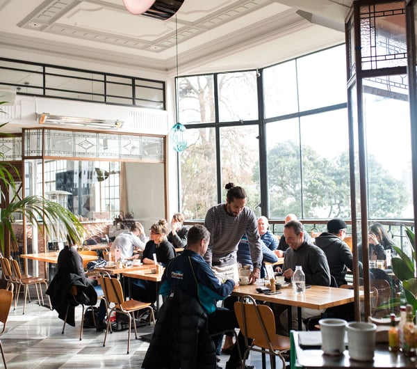 Guests dining inside Bestie Cafe in Auckland.