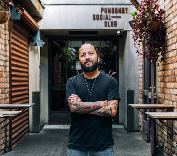 Bobby Brazuka standing in front of his business the Ponsonby Social Club in Auckland.