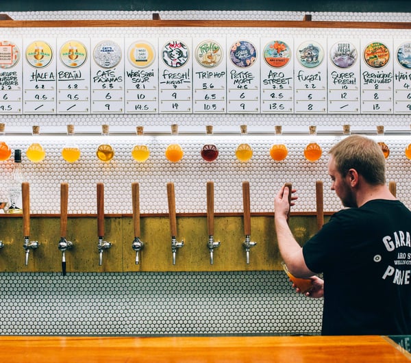 A man pouring beer.