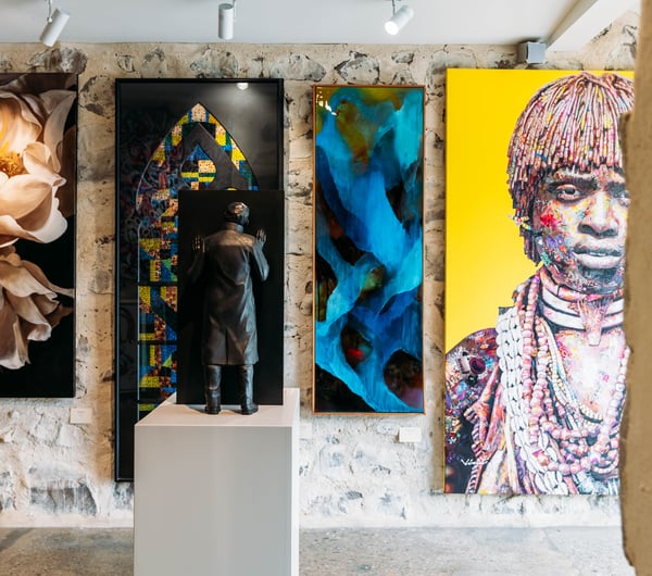 Artworks on the wall at Artbay Gallery in Queenstown.