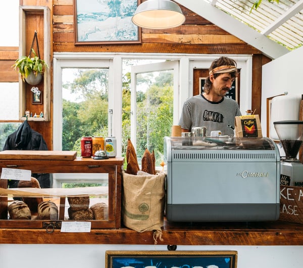 A staff member working behind the counter in the Bacca Bakery cafe.
