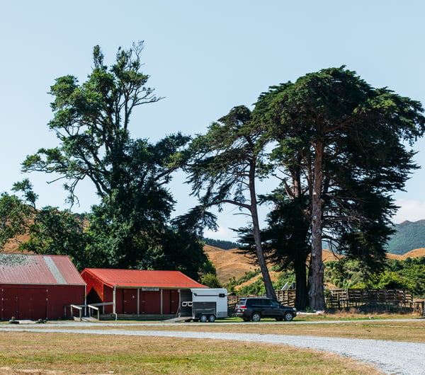 Red sheds and rolling hills.
