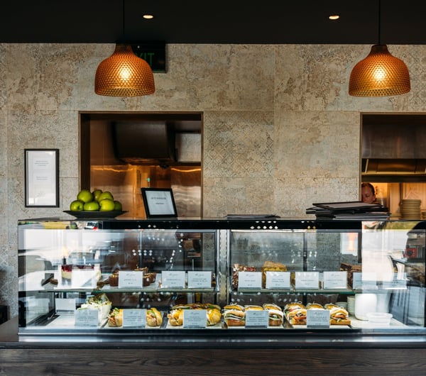 A glass counter inside a cafe.