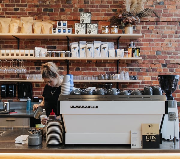 A barista making coffee.