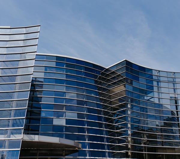 Exterior curved glass building of the Christchurch Art Gallery.