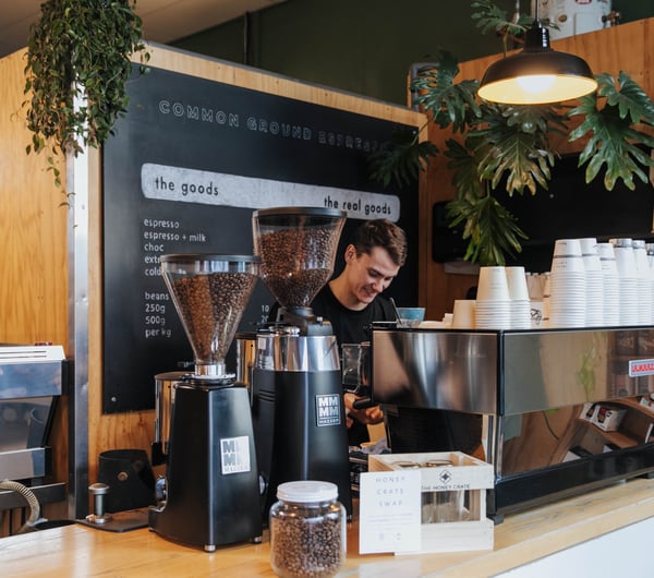 A barista making coffee.