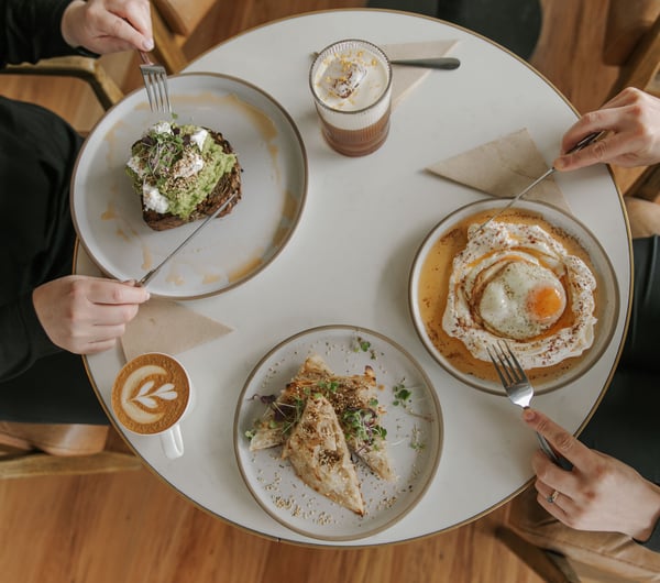 People sitting around a table eating brunch.