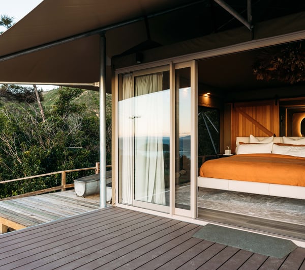 A view of the bed from the deck at Drift Off.