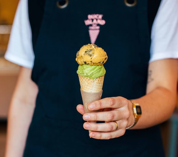Someone holding an ice cream.
