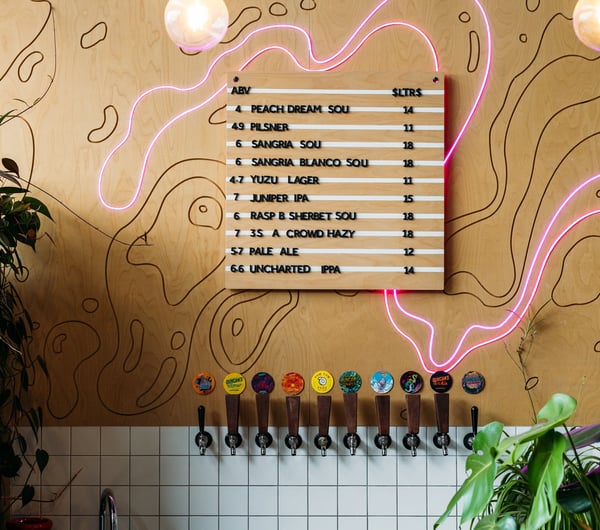 A decorative wall behind beer taps at Duncan's.